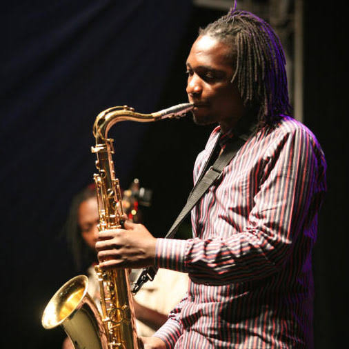 Juma Tutu playing saxophone on stage