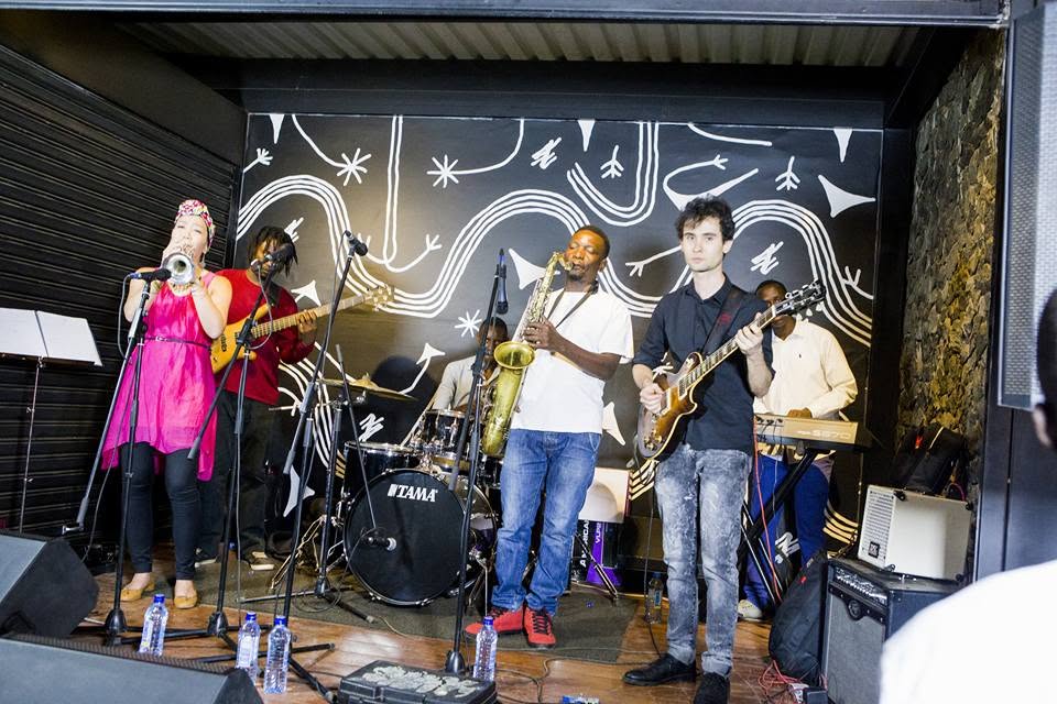 Full band performing on stage